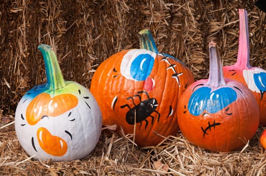 Pumpkins are painted as decoratino.