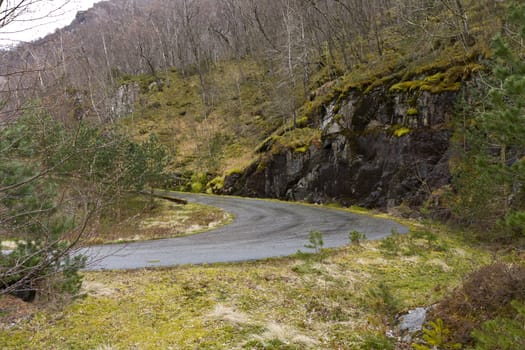 unused, run-down road in rural landscape - norway