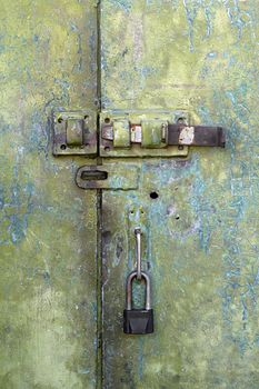 old iron door with a lock and hasp
