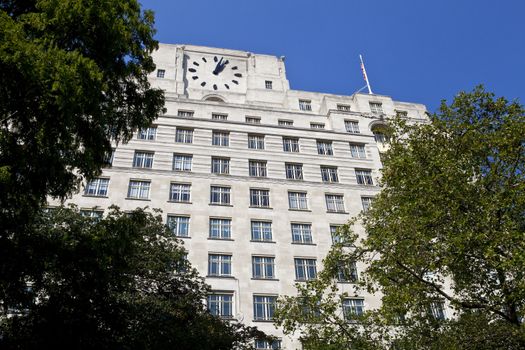 Looking up at the art deco facade of the shell Mex Building in London.