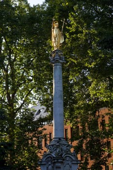 The guilded statue of St. Paul in the churchyard of St. Paul's Cathedral in London.