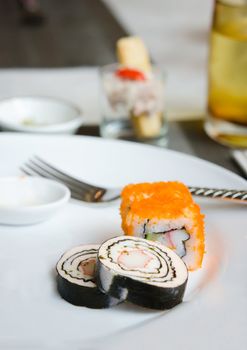 sushi and rolls  ,smoked salmon ham rolls with seaweed and crab stick