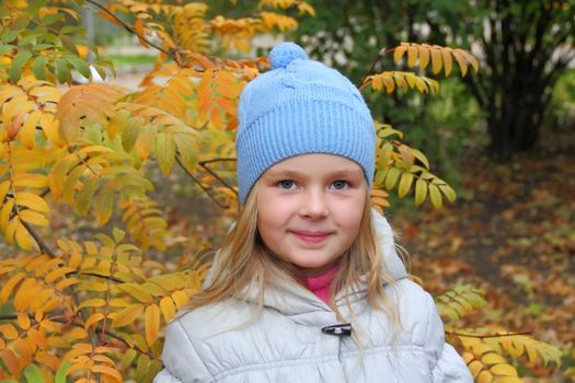 Portrait of beautiful girl with blond hair and blue eyes