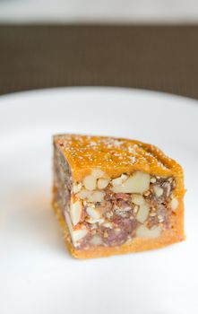 pieces of chinese moon cake in white plate