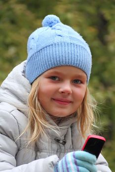 Portrait of small girl with cellular phone