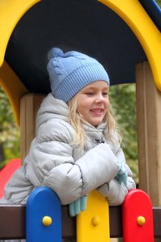 Portrait of beautiful girl with blond hair and blue eyes