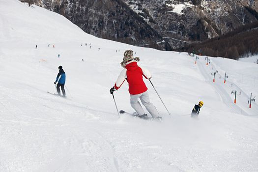 Skiers going down the slope