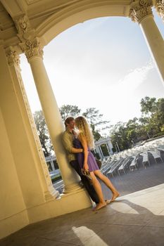 Attractive Playful Loving Couple Portrait in the Outdoor Amphitheater.