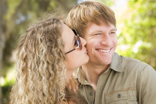 Happy Attractive Loving Couple Portrait in the Park.