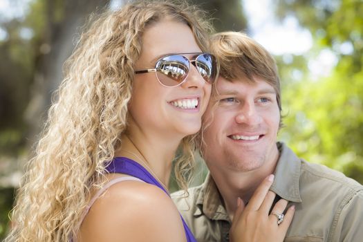 Happy Attractive Loving Couple Portrait in the Park.