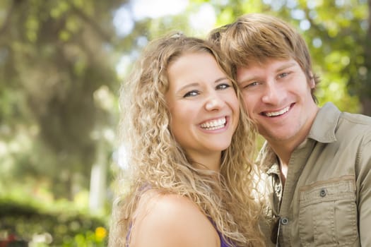 Happy Attractive Loving Couple Portrait in the Park.