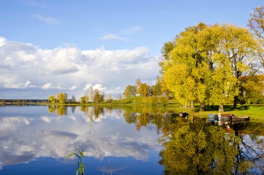 beautiful autumn lake evening landscape and boats