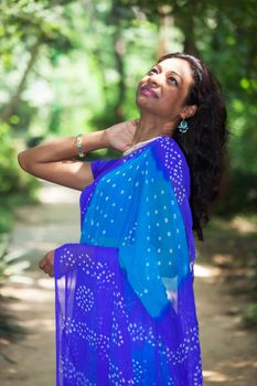 young indian woman in a saree outdoors