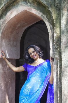 young indian woman in a saree outdoors