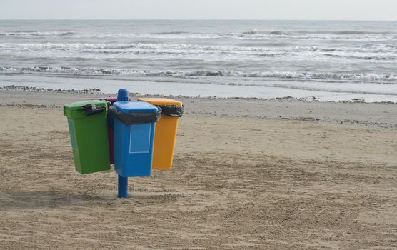 Garbage cans on the beach in Cervia in Italy