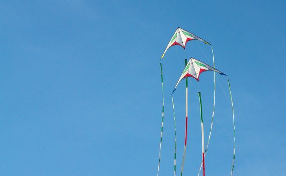 Two kites flying in the sky