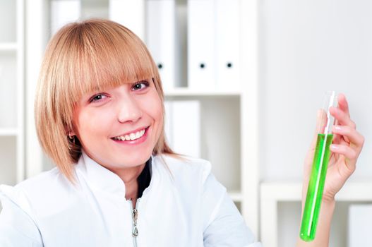 chemist working in the laboratory, mix liquid