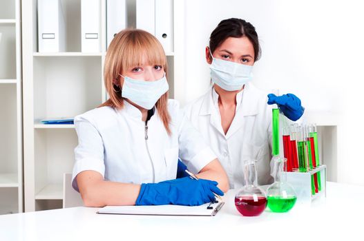 group of scientists working in laboratories with equipment