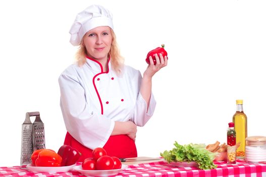 Portrait of attractive cook woman, holding a paprika