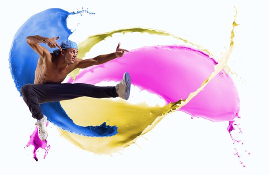 Dancer jumping on the background color splashes