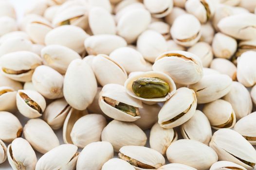 close up pistachios nuts on white background