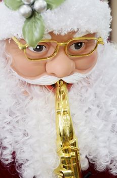 Close-up of Santa Claus playing musical instrument 