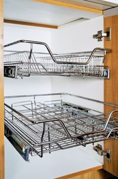 Open kitchen cabinet with two layers of stainless dish rack