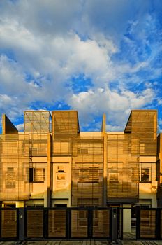 Exterior shot of contemporary apartment bathe in sunset