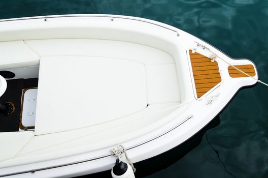 Top shot of bow of white speed boat on water