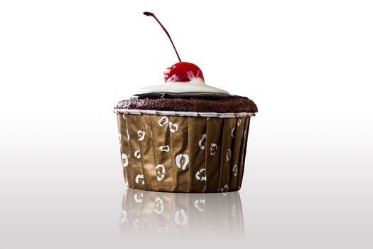 Chocolate  Cupcakes decorated with red cherry on isolated