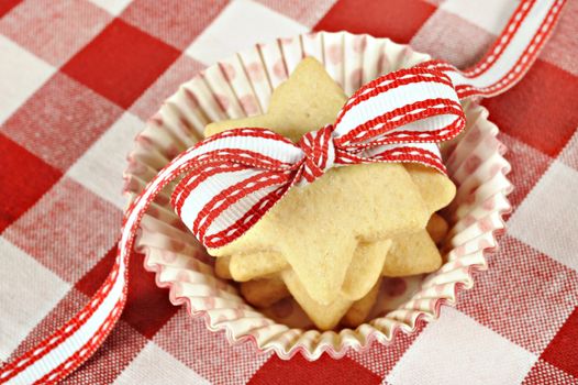 Star cookies with ribbon on cloth