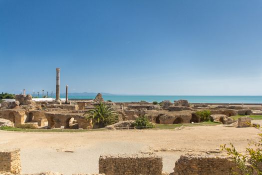 Ruins in ancient Carthage town, a UNESCO World Heritage site in Tunisia with ruins of great buildings, theaters, villas, baths, houses and columns from the great Punic and Roman empires