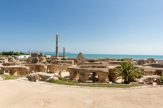 Ruins in ancient Carthage town, a UNESCO World Heritage site in Tunisia with ruins of great buildings, theaters, villas, baths, houses and columns from the great Punic and Roman empires