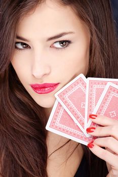 Pretty long hair woman holding gambling cards