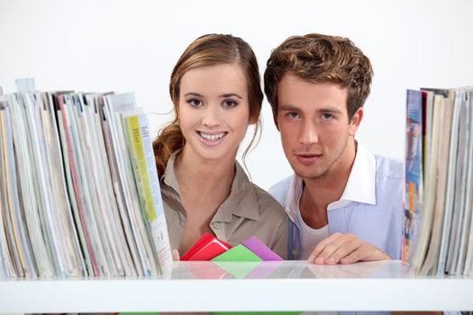 Young couple in library