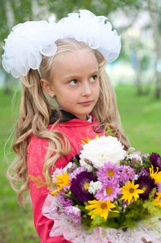 Schoolgirl dressed with a bouquet