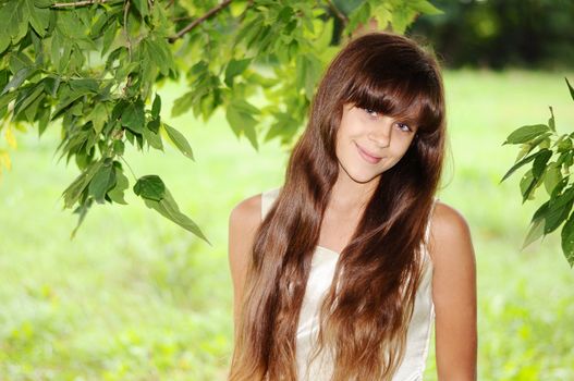 A young woman in a summer park