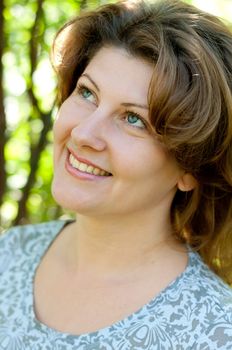 Middle-aged woman in a summer park