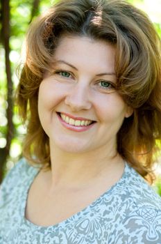 Middle-aged woman in a summer park