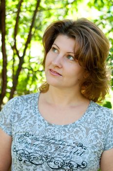 Middle-aged woman in a summer park