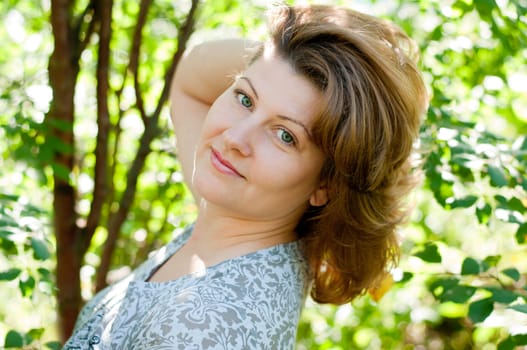 Middle-aged woman in a summer park