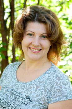 Middle-aged woman in a summer park