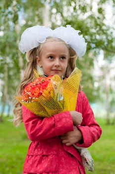 Schoolgirl dressed with a bouquet