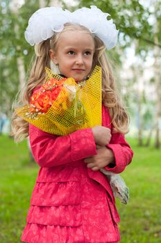 Schoolgirl dressed with a bouquet