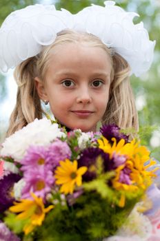 Schoolgirl dressed with a bouquet