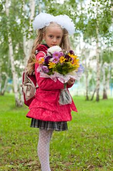 Schoolgirl dressed with a bouquet