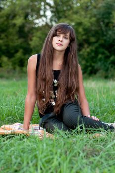 Brunette teen girl on nature