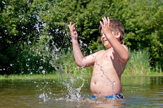 A boy swims in the river