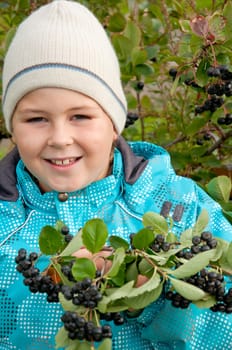 A boy with a sprig of Aronia