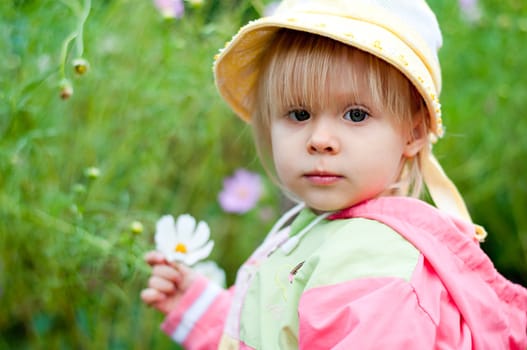 Little girl with flowers 2.5 years